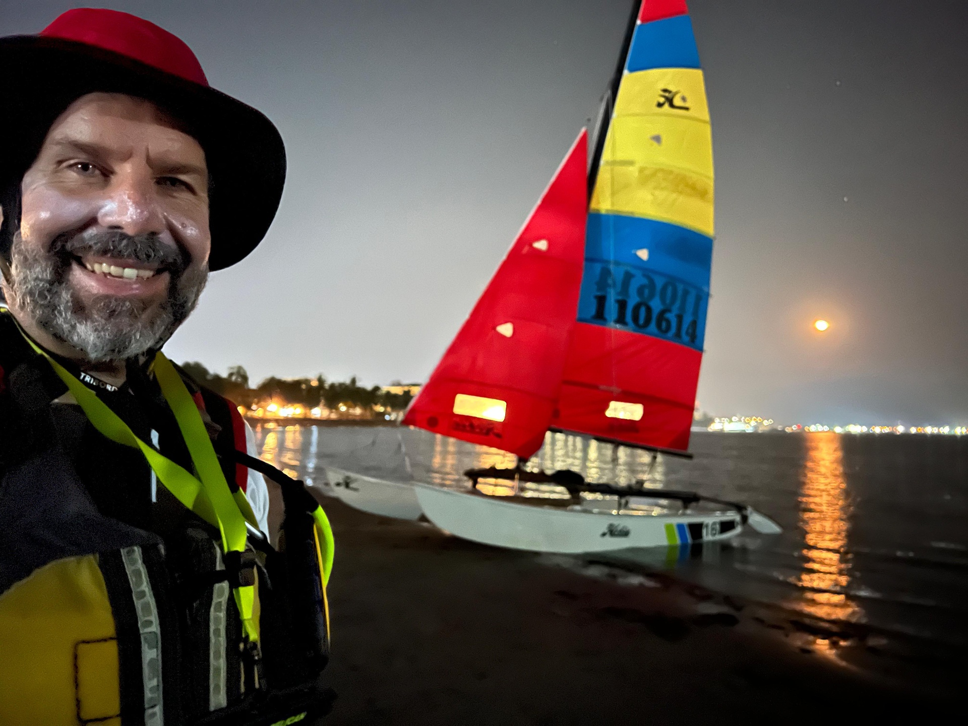 Moonrise launch — night sail with the full moon over Subic Bay.